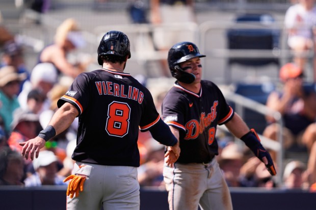 Detroit Tigers Matt Vierling (8) is greeted by Kevin McGonigle after the two scored on a 2-run RBI in the fifth inning of a spring training baseball game against the Tampa Bay Rays in Port Charlotte, Fla., Saturday, Feb. 28, 2026. (AP Photo/Gerald Herbert)
