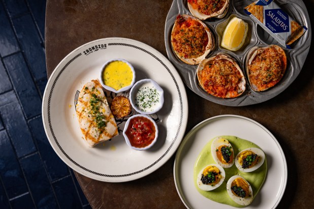 Three dishes on the new menu at Ironside Fish & Oyster in Little Italy, local catch swordfish, left,, Clams Casino, top right, and oeufs mayonnaise with caviar, bottom right. The restaurant reopens March 25 after a five-week renovation and kitchen upgrade. (James Tran)