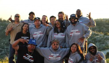 Justice Scholars - a group of happy people in the photo