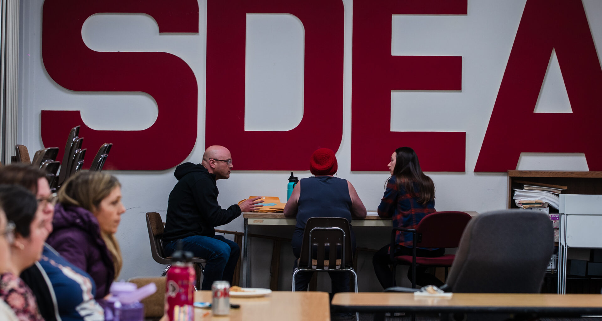 Members of the High Tech Education Collective count votes during a meeting at the San Diego Education Association on Feb. 2, 2023.