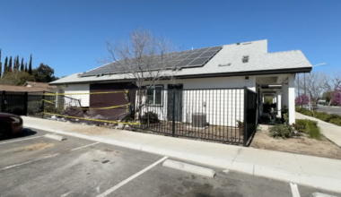 Suspect sought after stolen bulldozer crashes into building