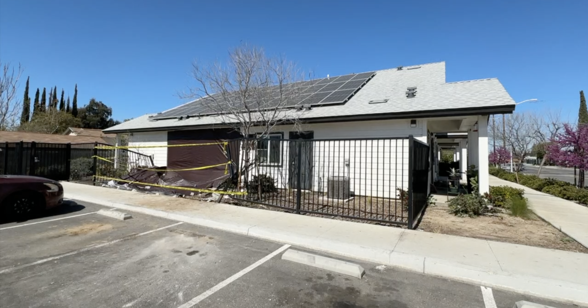 Suspect sought after stolen bulldozer crashes into building