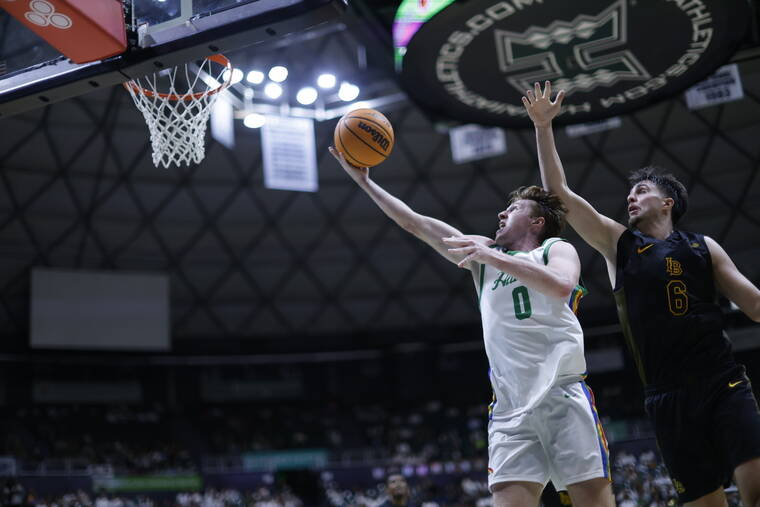 JAMM AQUINO / JAQUINO@STARADVERTISER.COM
                                Hawaiis Hunter Erickson drives to the basket against Long Beach State during the second half.