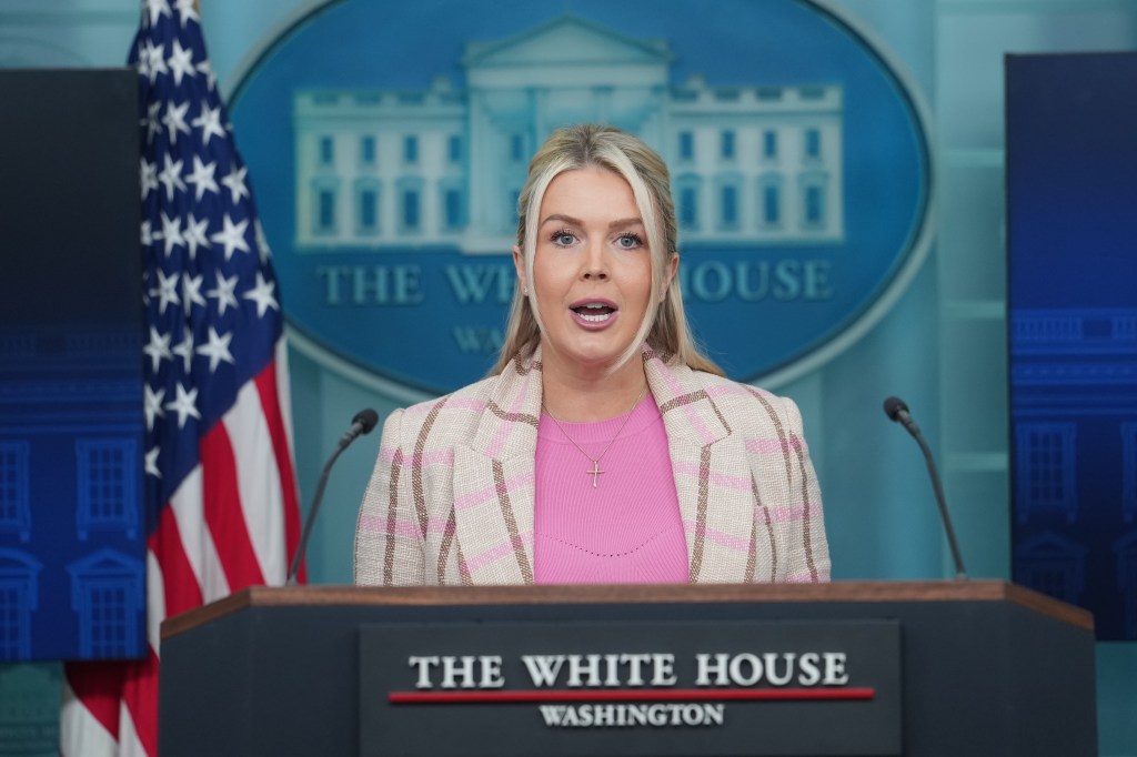 White House Press Secretary Karoline Leavitt speaks at a podium with the White House seal in the background.