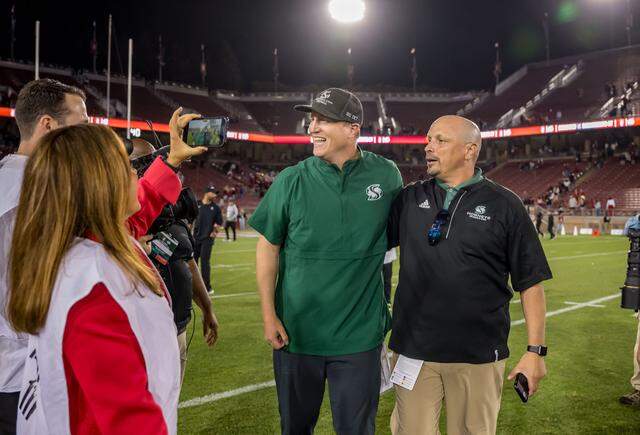 Sacramento State Hornets coach Andy Thompson and athletic director Mark Orr celebrate after their 30-23 win over the Stanford Cardinal in the NCAA college football game Saturday, Sept. 16, 2023, at Stanford University. 