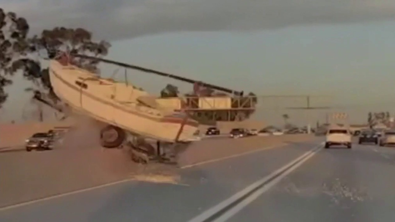 Boat flies over 91 Freeway divider in Bellflower