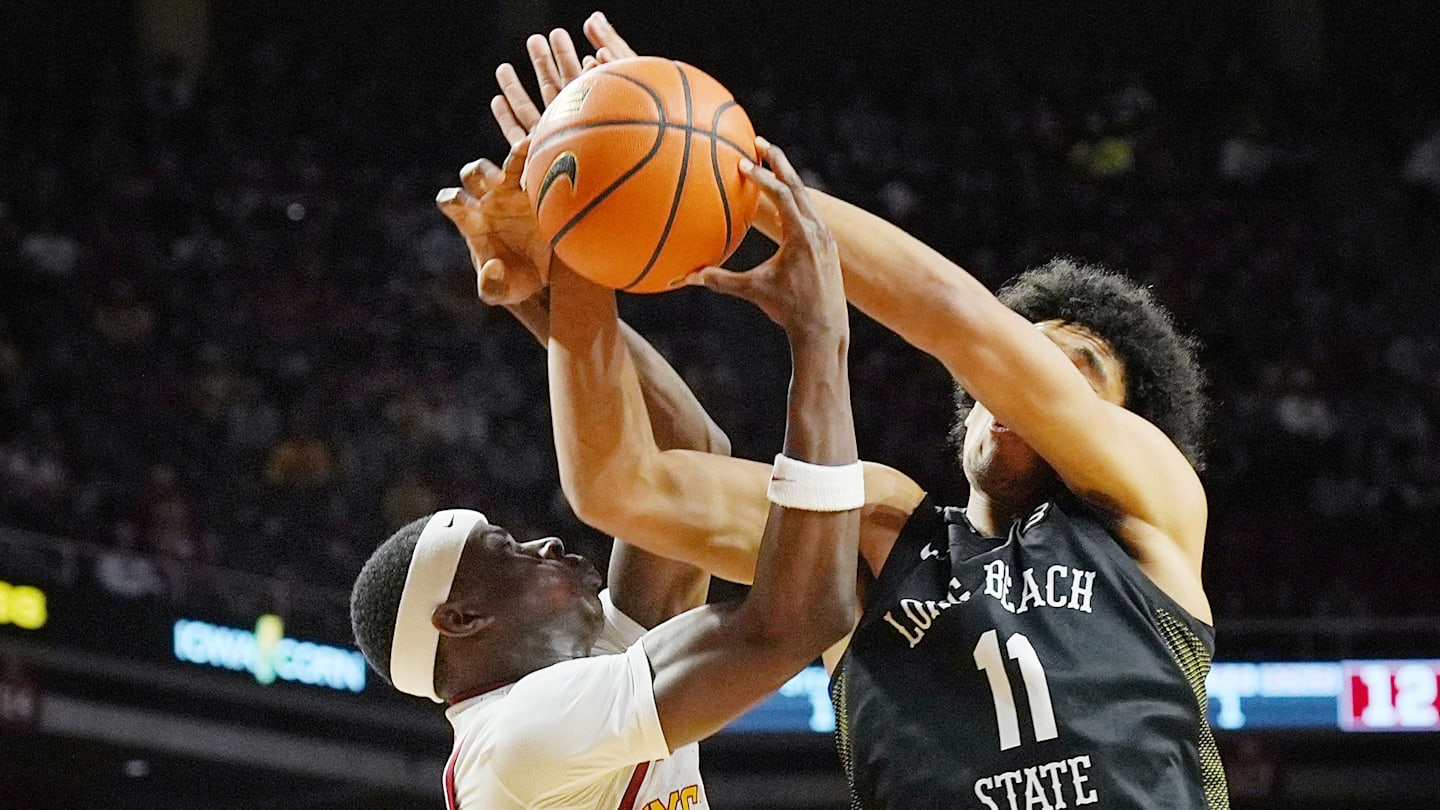 Iowa State Cyclones forward Killyan Toure (27) and Long Beach State guard Gavin Sykes (11) battle for rebound during the first half in the NCAA men’s basketball on Dec. 21, 2025, at Hilton Coliseum in Ames, Iowa.