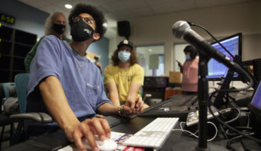 Jordan Reyes looks up to instructor at the soundboard