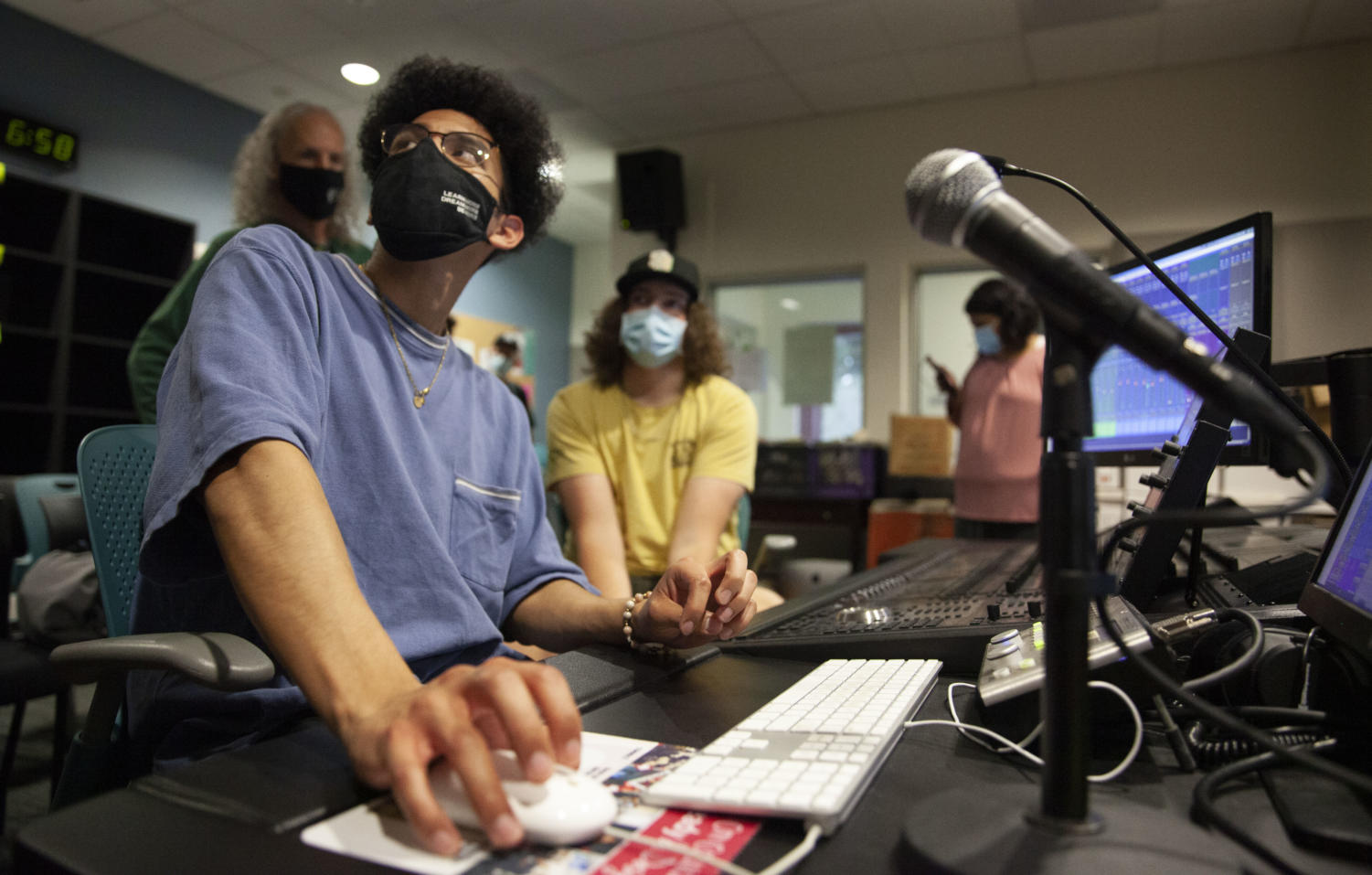 Jordan Reyes looks up to instructor at the soundboard
