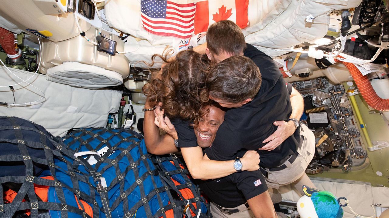 "Mission Specialist Christina Koch, left, Mission Specialist Jeremy Hansen, Commander Reid Wiseman, and Pilot Victor Glover – take time out for a group hug inside the Orion spacecraft on their way home," NASA stated. (NASA)