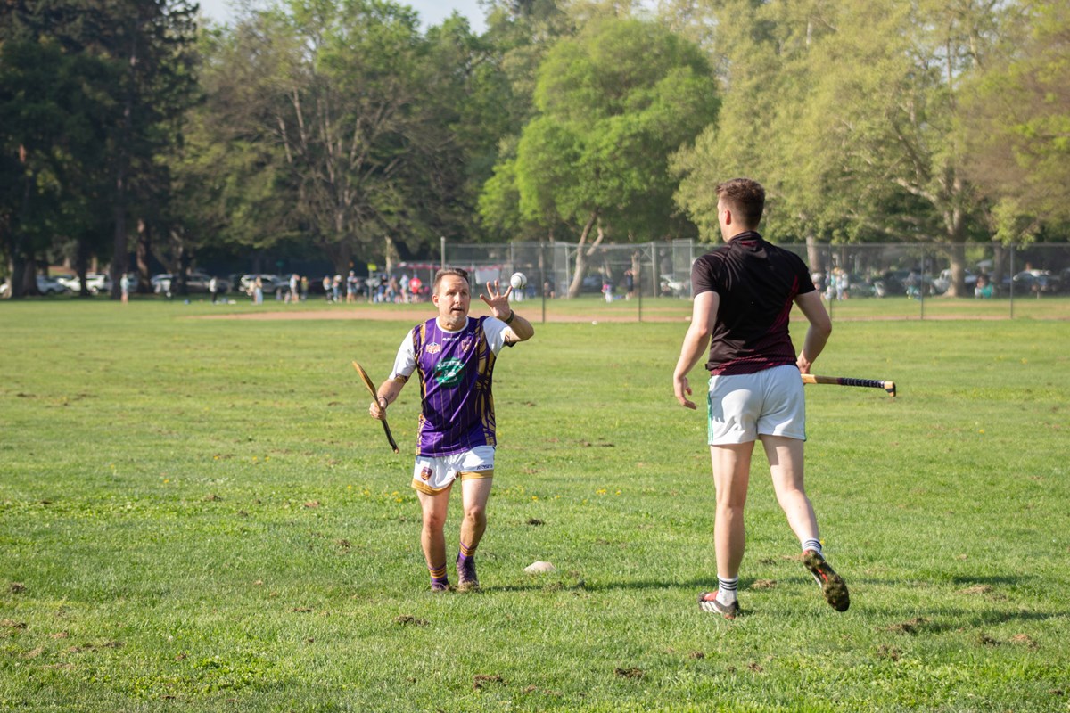 Marlin Ó Ciarmhaic (left) catches a hand pass from David Neligan (right) during a Sacramento Kavanagh's practice Saturday, March 21, 2026, in Sacramento.