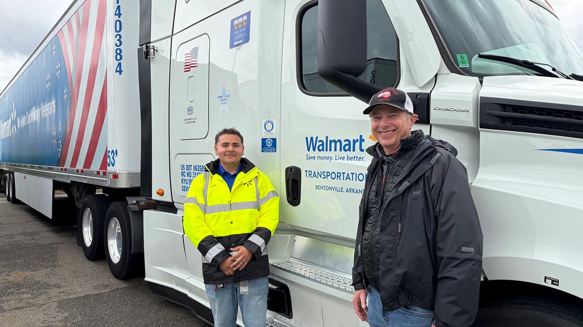 David Kastiro, left, and Dave Dein pose at the Northern California Truck Driving Championships in West Sacramento on Saturday, April 11, 2026. Kastiro, 23, learned to drive trucks through Dein's program at Patterson High School.