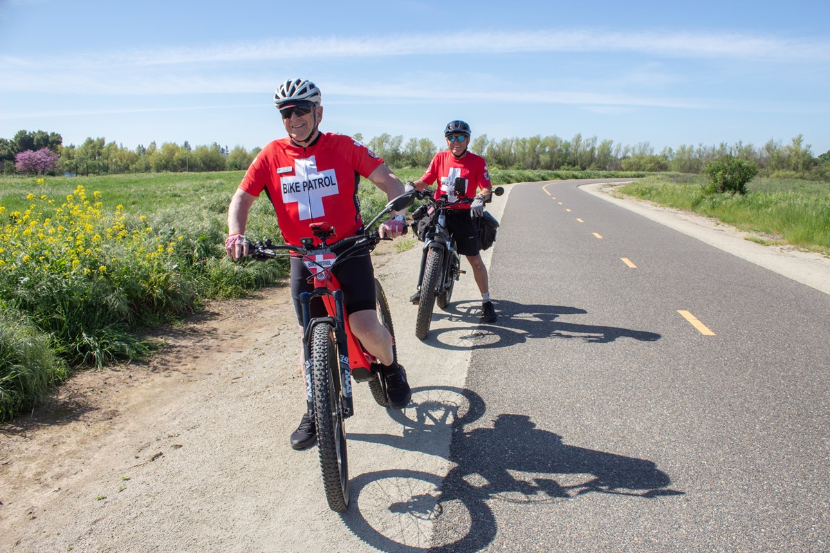 American River Bike Patrol director John Poimroo (left) and Christopher Warren Tuesday, March 17, 2026, along the American River Parkway in Rancho Cordova.