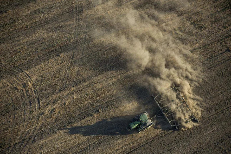A tractor plows a dusty field in the Westlands Water District west of Fresno.