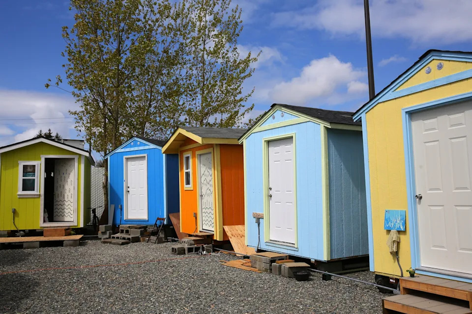 Colorful tiny houses are lined up inside the Georgetown tiny house village