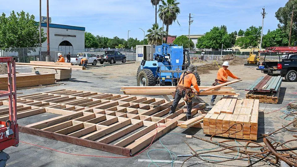 Workers begin construction on a new Dutch Bros Coffee going up near the old Javier's Mexican Restaurant on Kings Canyon Road east of Clovis Avenue on Wednesday, April 15, 2026.