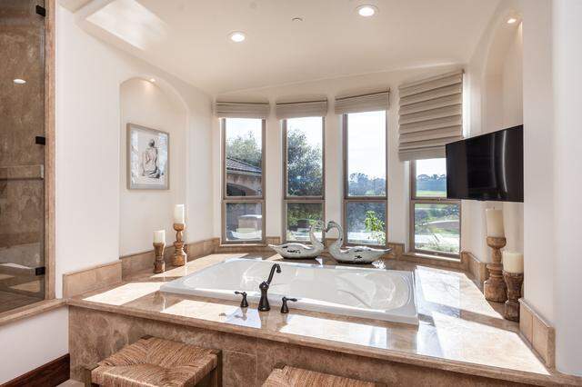 The single-story layout extends throughout the home. The primary suite is no exception.