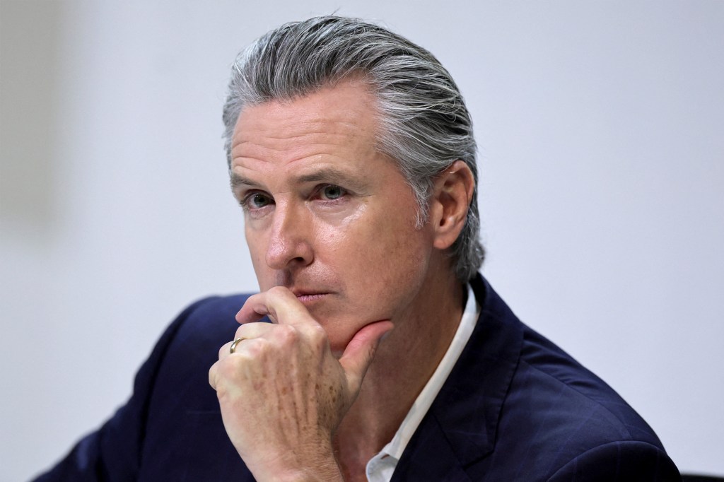 Gavin Newsom, governor of California, with his hand on his chin.