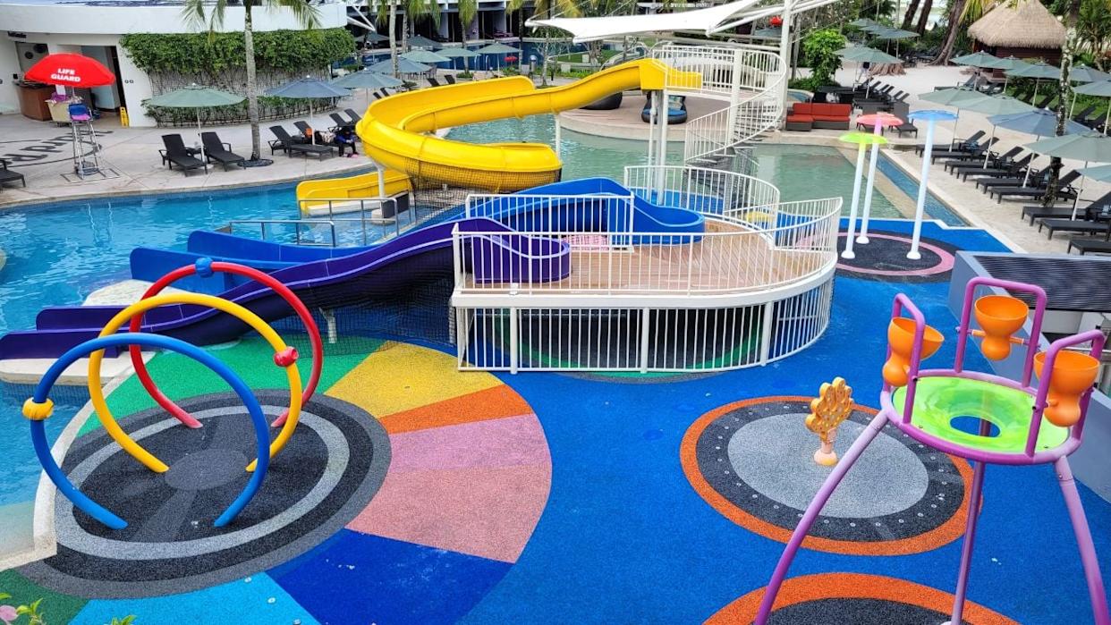 A colorful hotel splash zone with slides and water features designed for kids and families near Disneyland