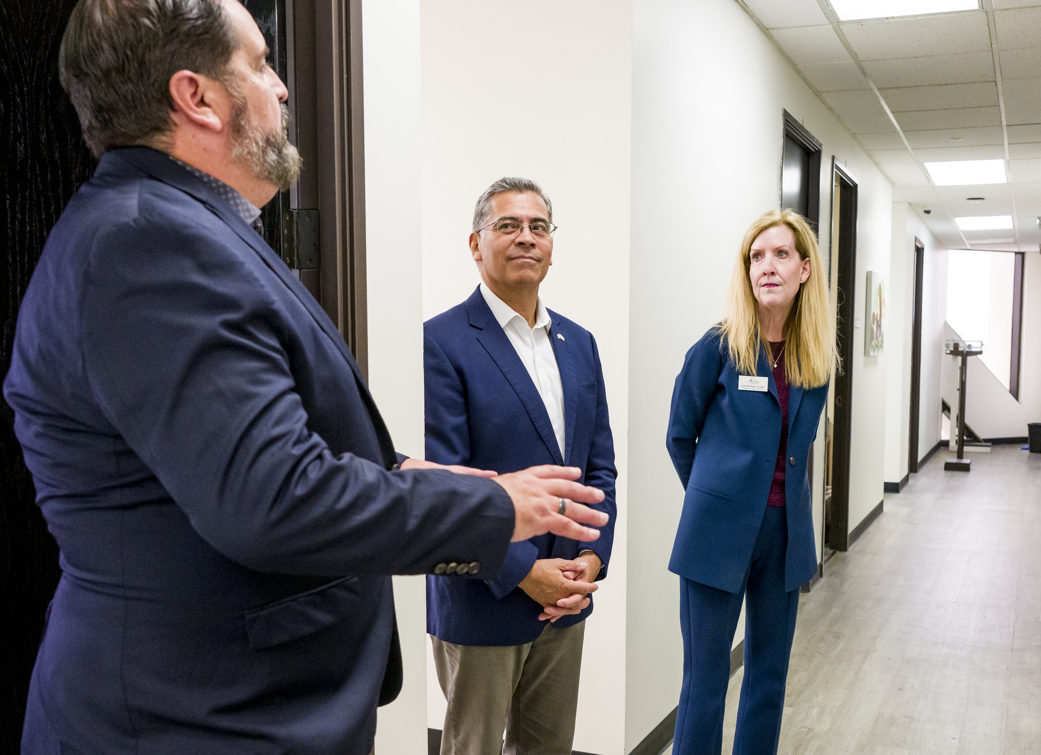 Former Health and Human Services Secretary Xavier Becerra, center, a...