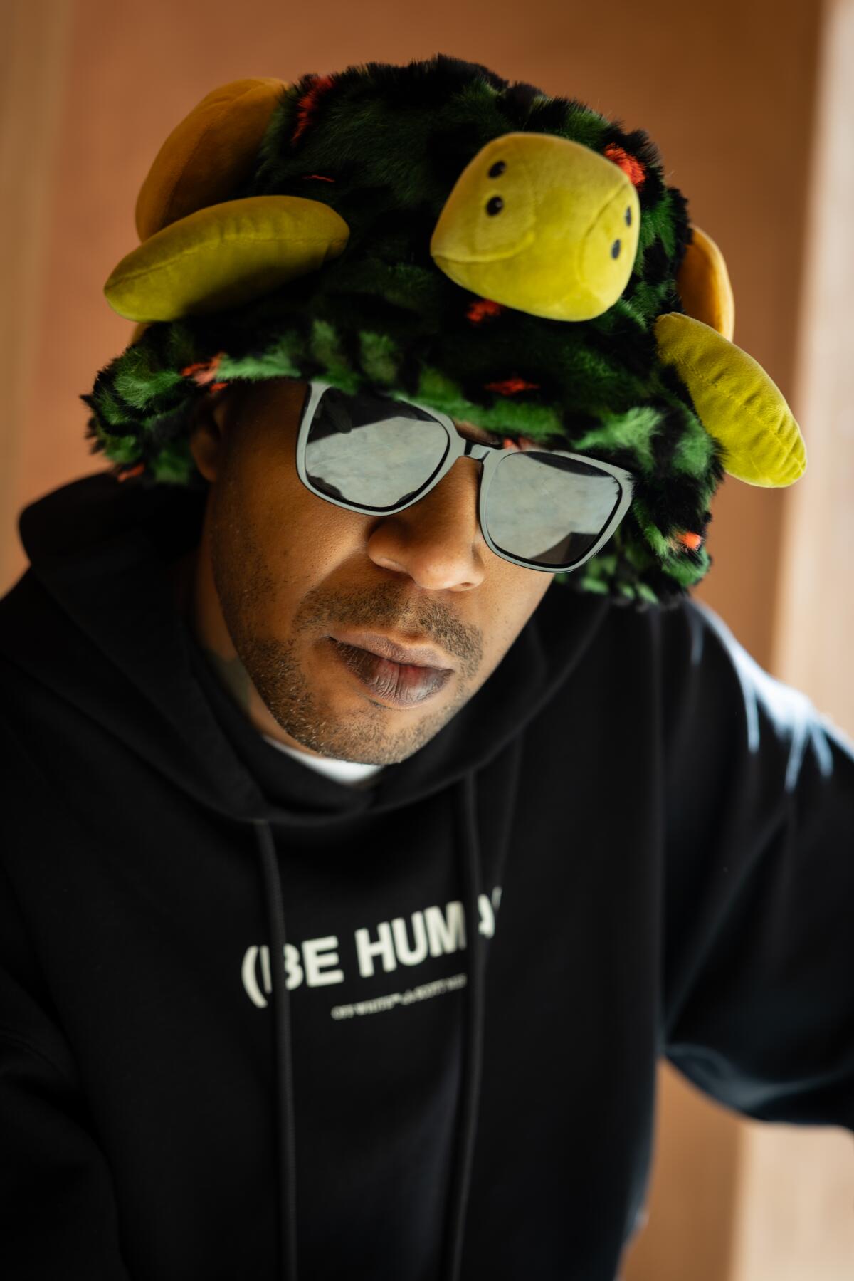 Kid Cudi poses for photo.