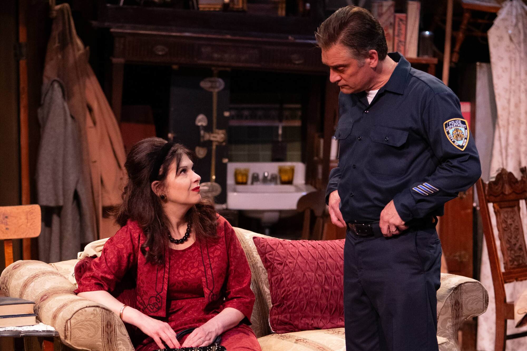 Dana Dewes and Scott G. Jackson stand in a living room in "The Price."