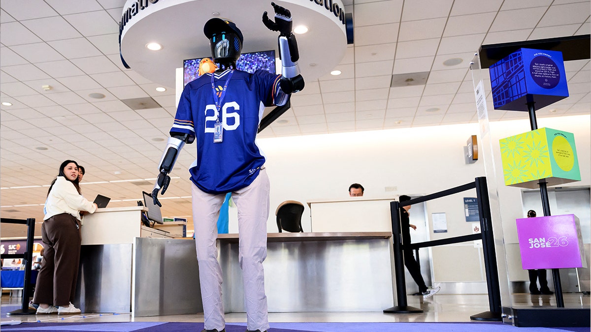 A humanoid robot waves.