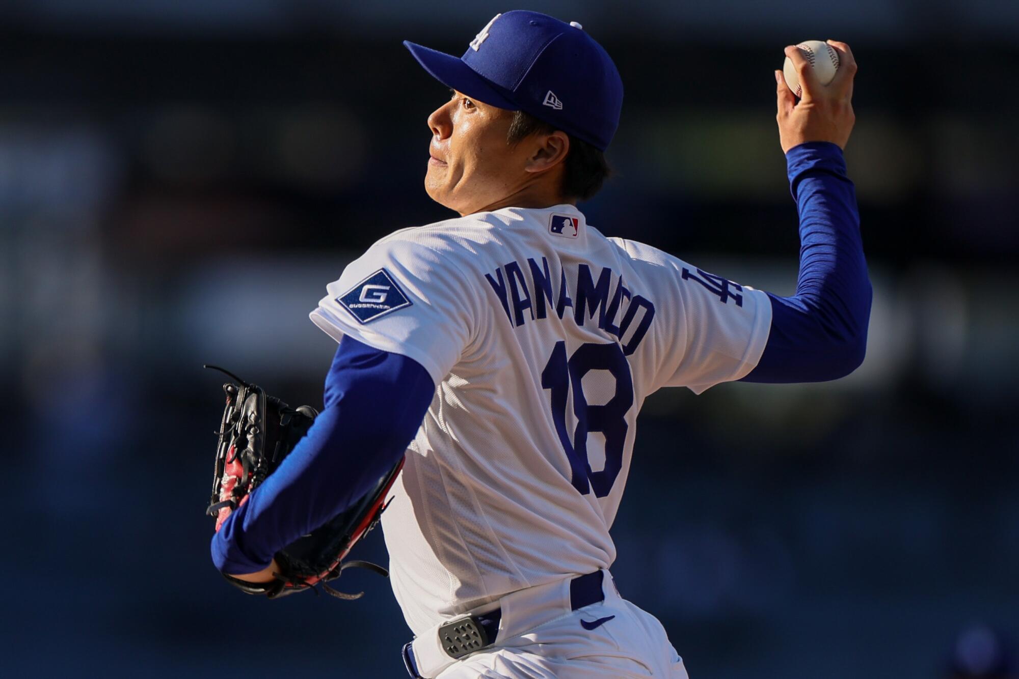 Dodgers starter Yoshinobu Yamamoto delivers during the first inning Wednesday against the Guardians.
