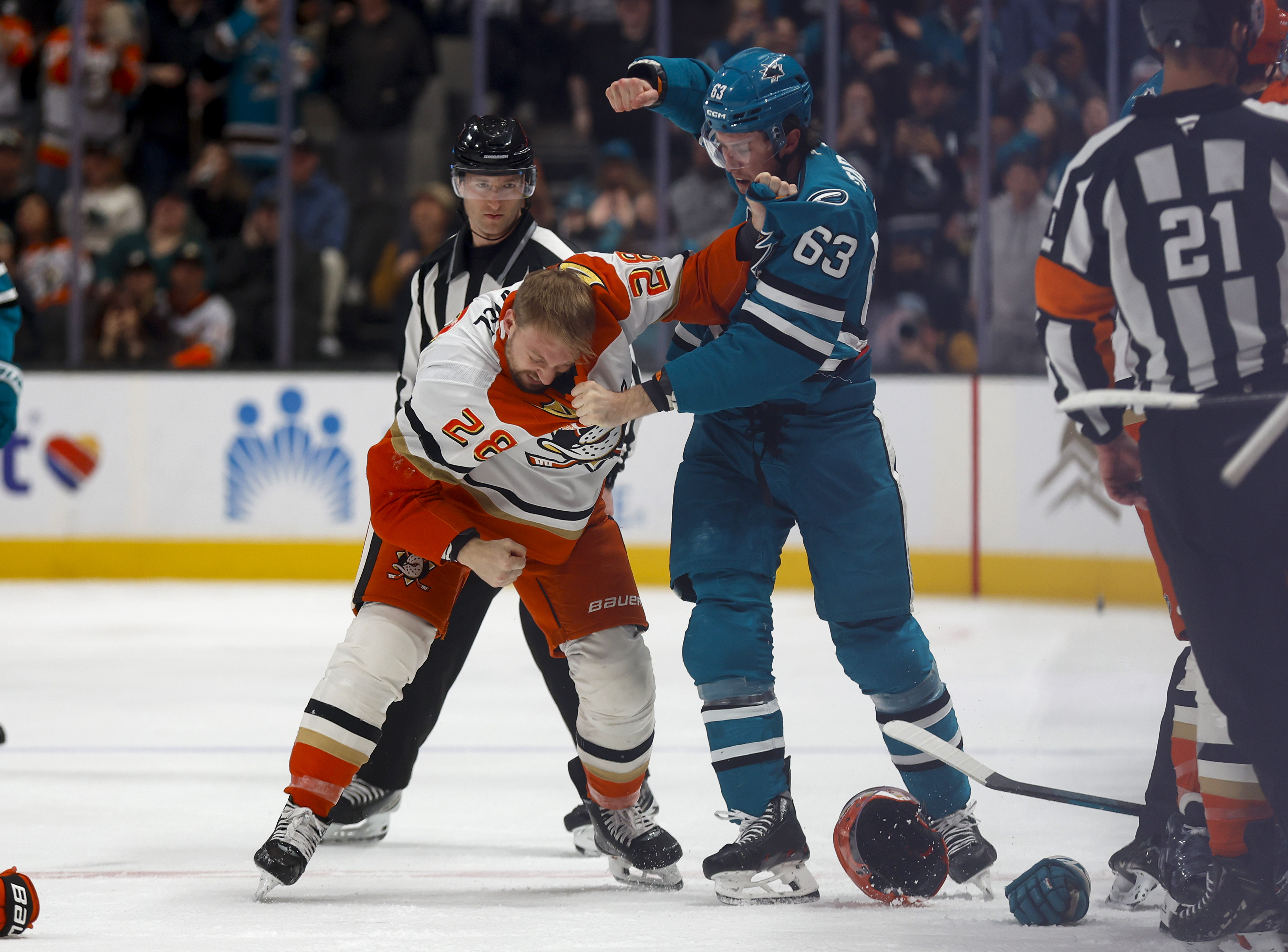 San Jose Sharks’ Zack Ostapchuk (63) fights with against Anaheim...