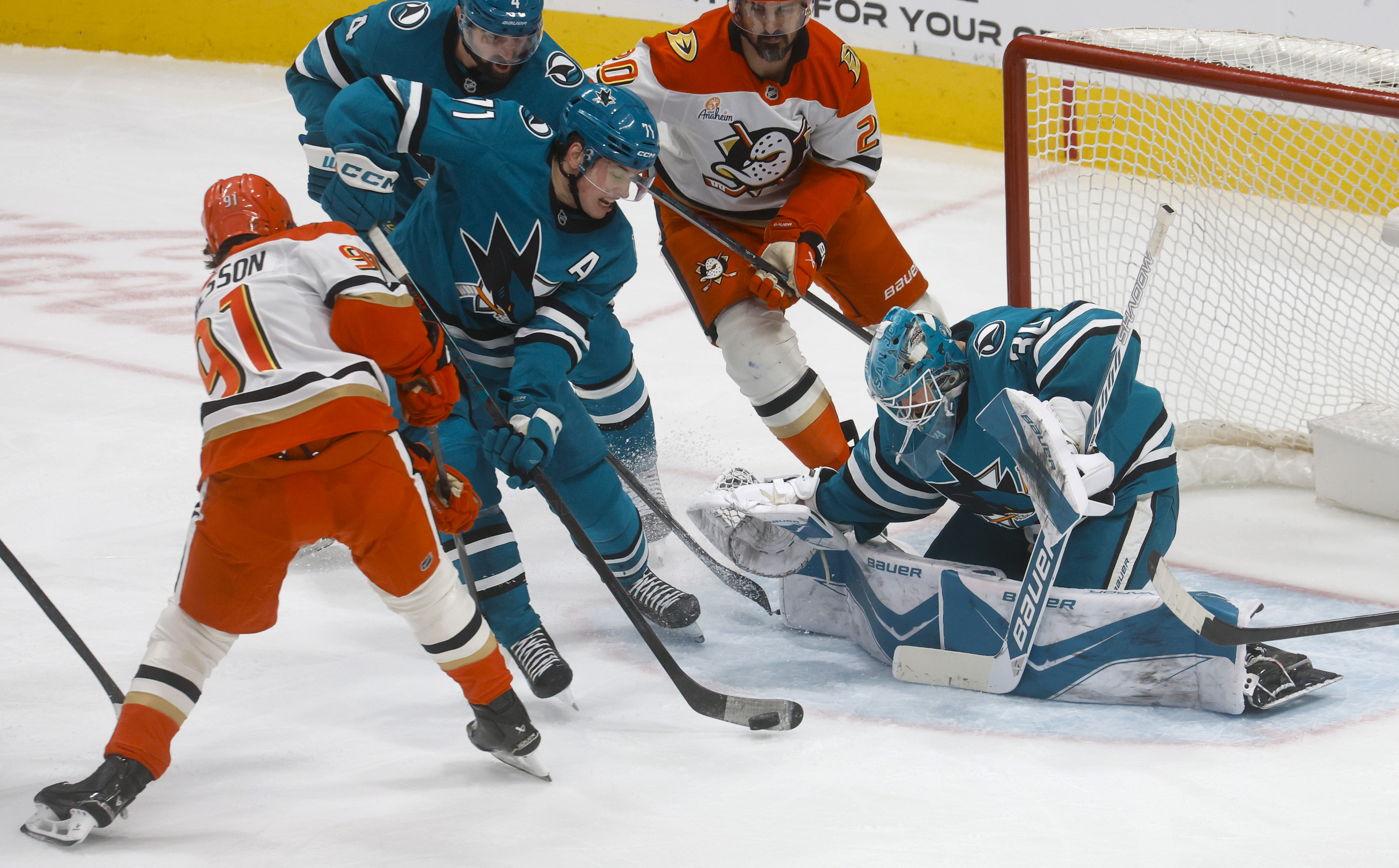San Jose Sharks’ Macklin Celebrini (71) clears the puck in...