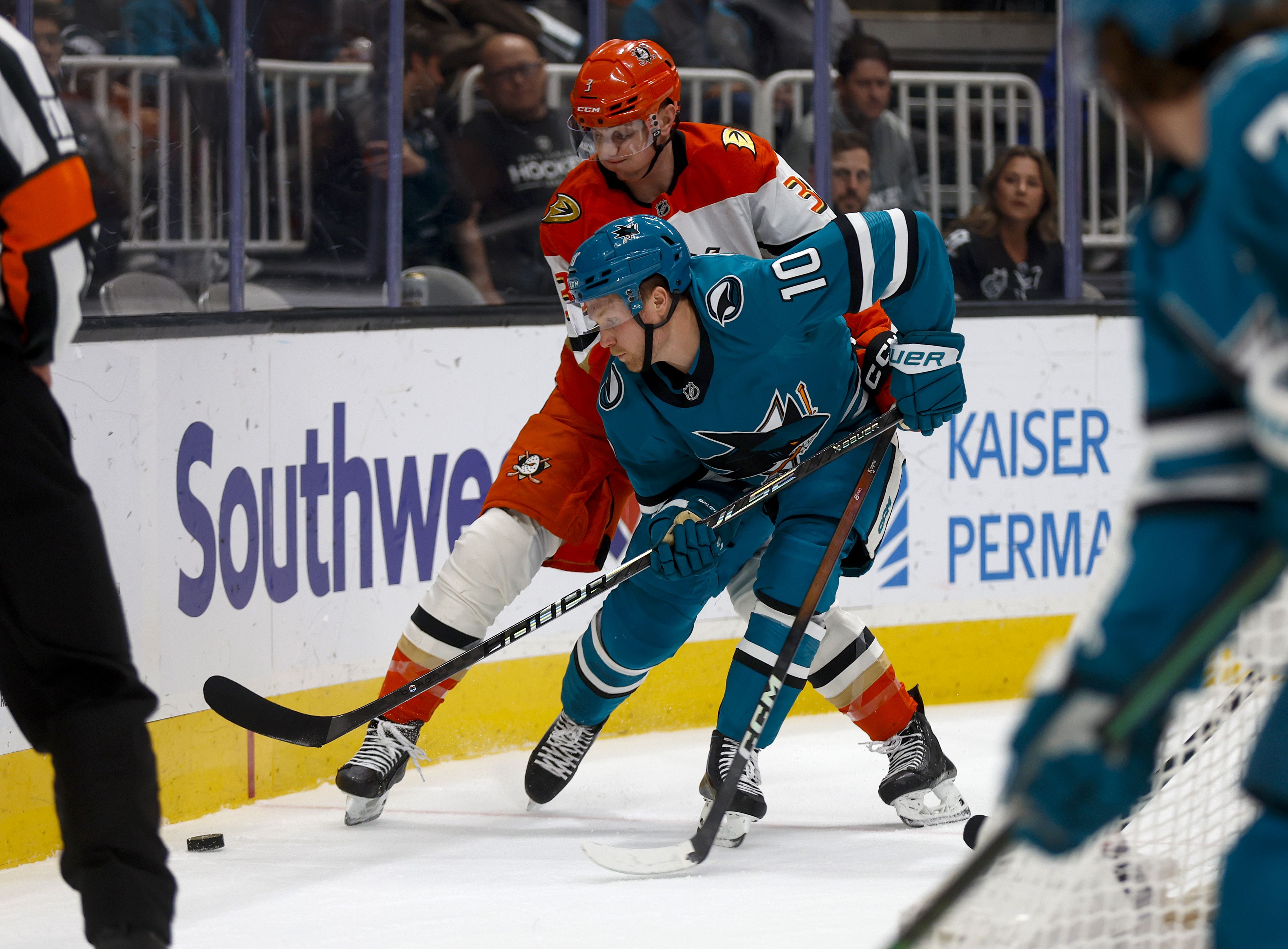 San Jose Sharks’ Ty Dellandrea (10) fights for the puck...
