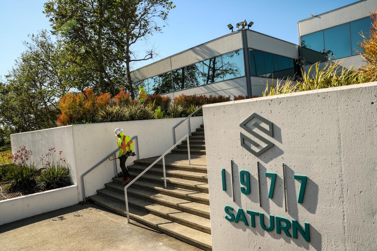 A man in front of a building.