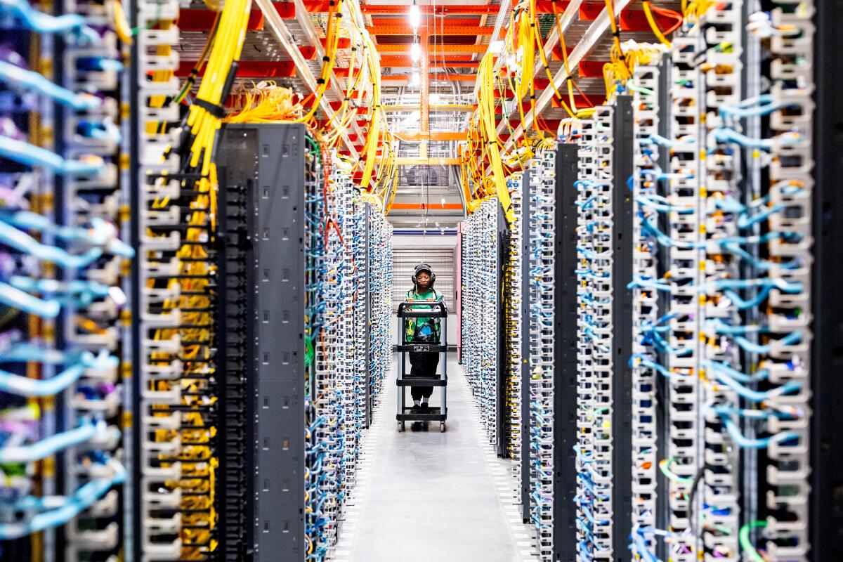 A technician works at an Amazon Web Services AI data center in New Carlisle, Ind.