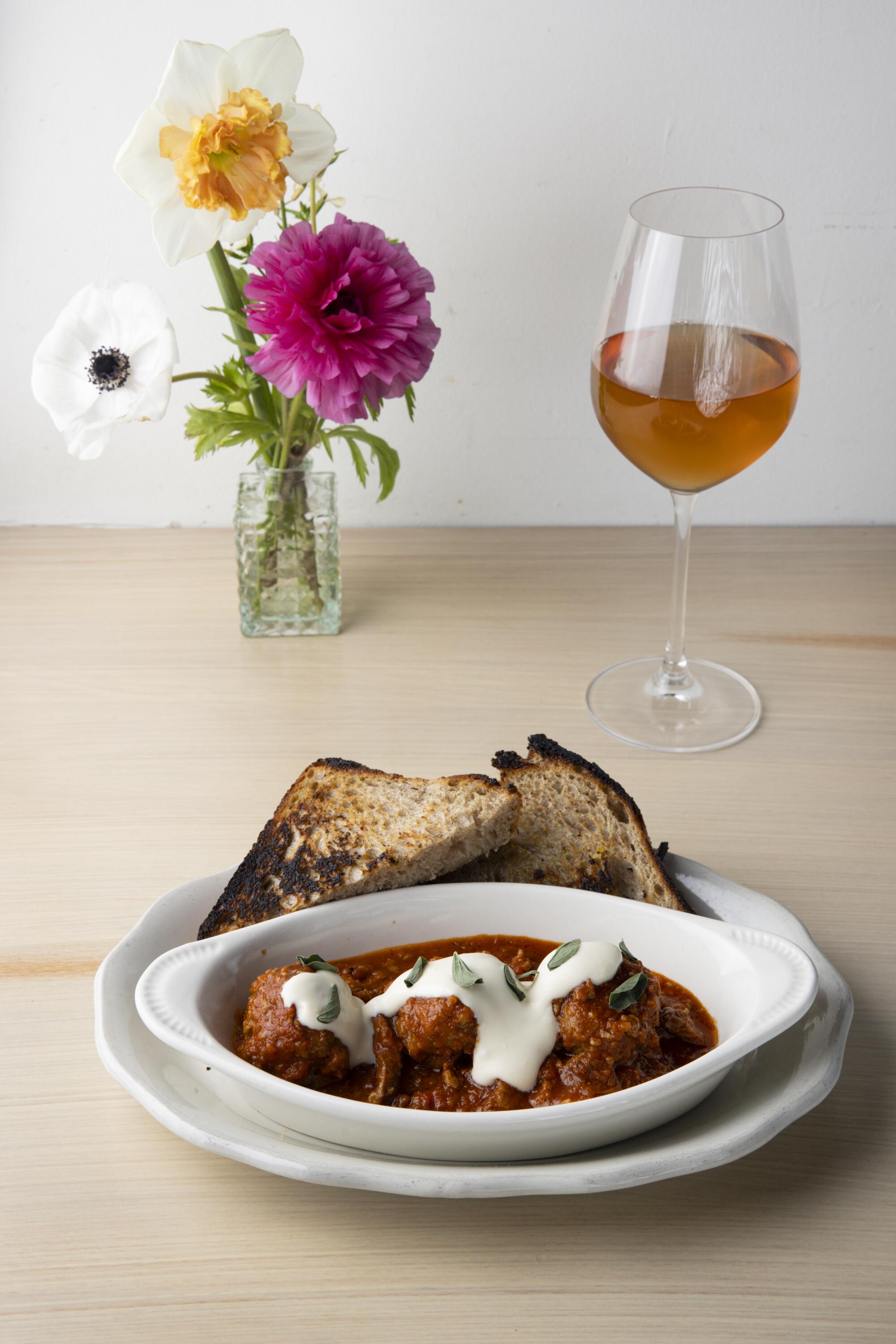 The Meatballs in Sunday gravy at Colossus Harbor. They're made with the restaurant's sourdough country bread.