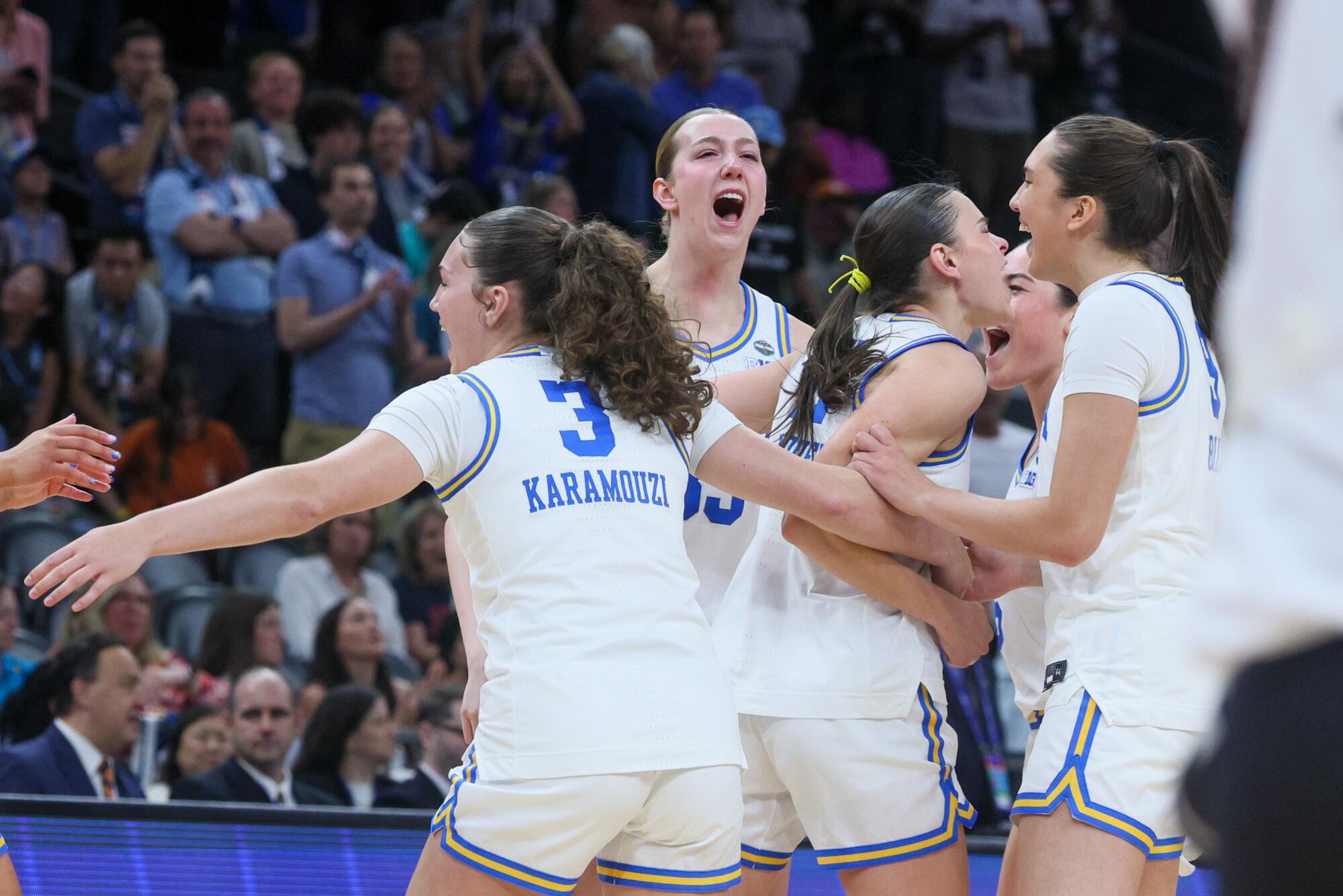 UCLA players celebrate after defeating Texas in the Final Four.
