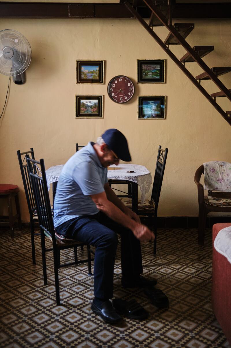 Alberto González put on his shoes for a night of dancing. 