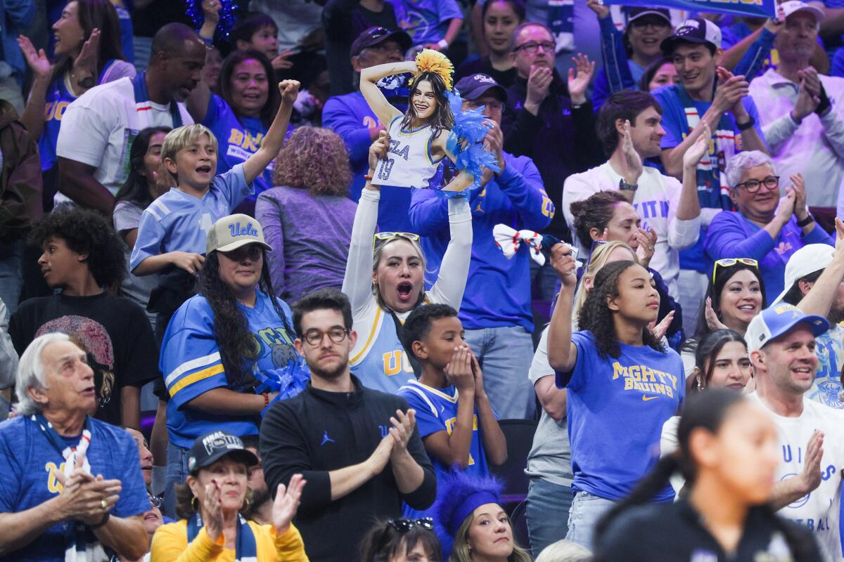 UCLA fans cheer during the first quarter of the Bruins' win over Texas during a Final Four game Friday.
