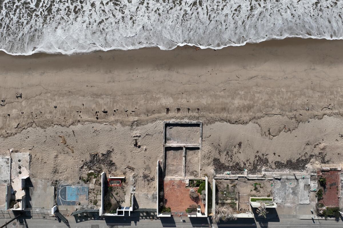 Aerial image of the remnants of an oceanfront neighborhood