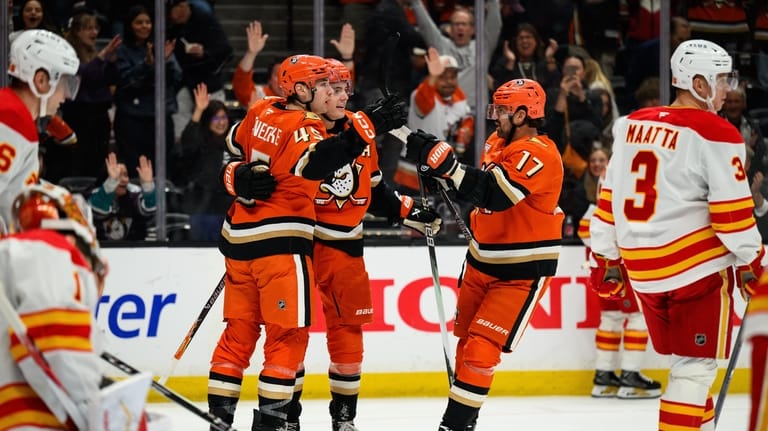 Anaheim Ducks right wing Beckett Sennecke (45) is greeted by...