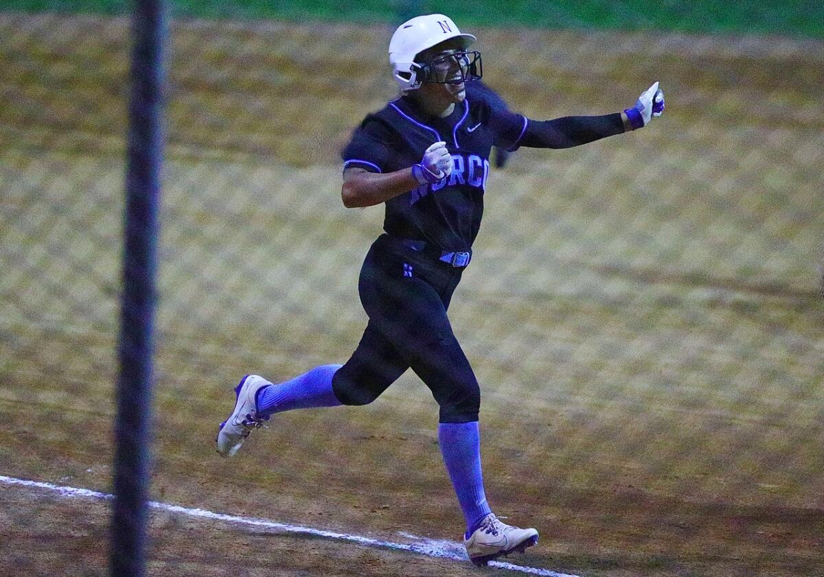 Norco’s Angelina Gonzales celebrates after hitting the first of two home runs.