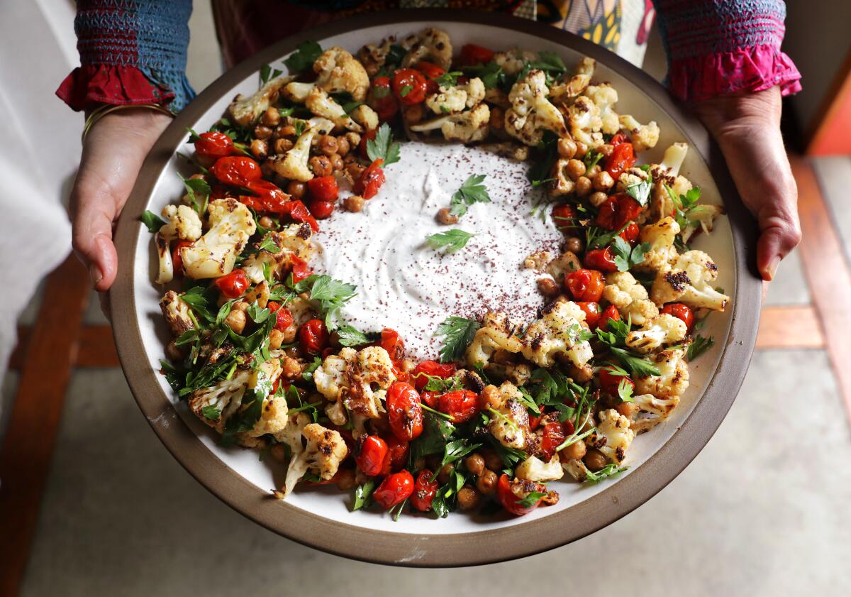 Chickpeas, cauliflower, tomato, and sumac yogurt by Jeanne Kelley.