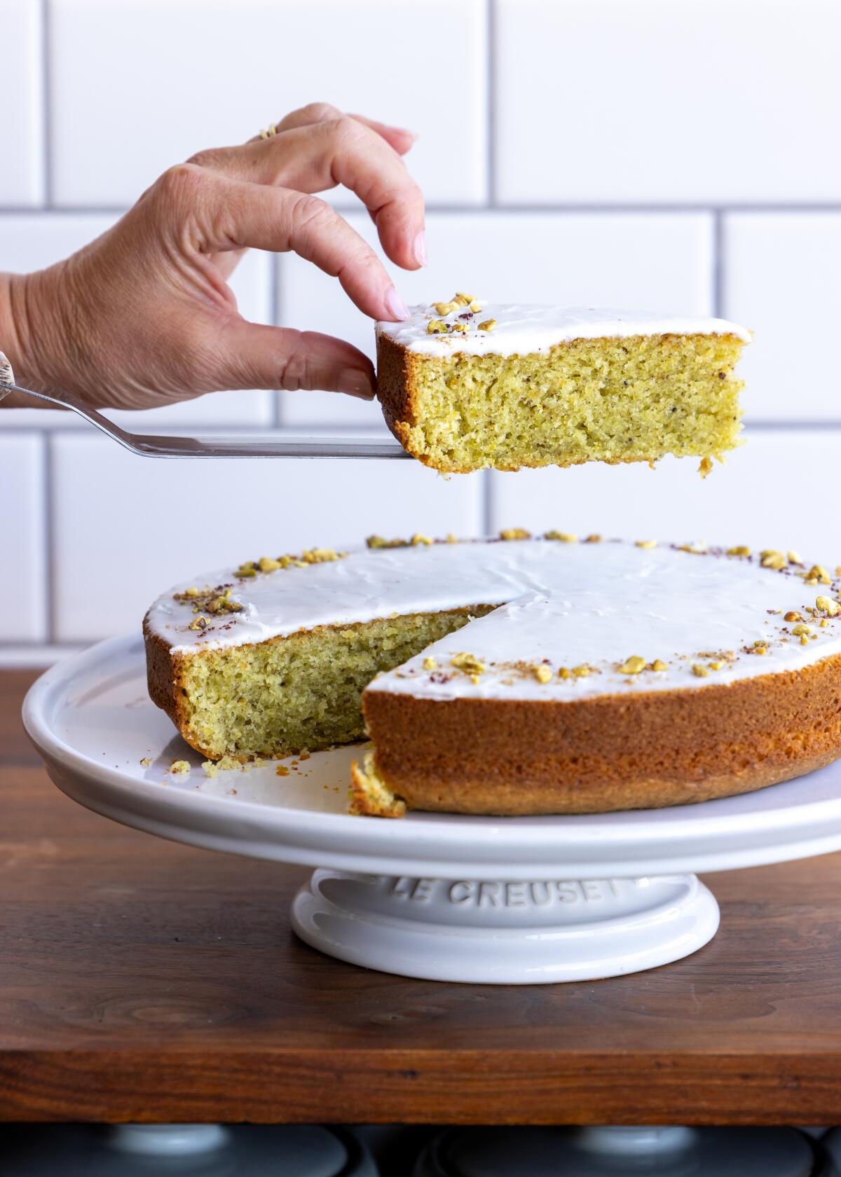 Pistachio olive oil cake with lemon glaze and a topping of pistachios, sumac and coriander from Valerie Confections.