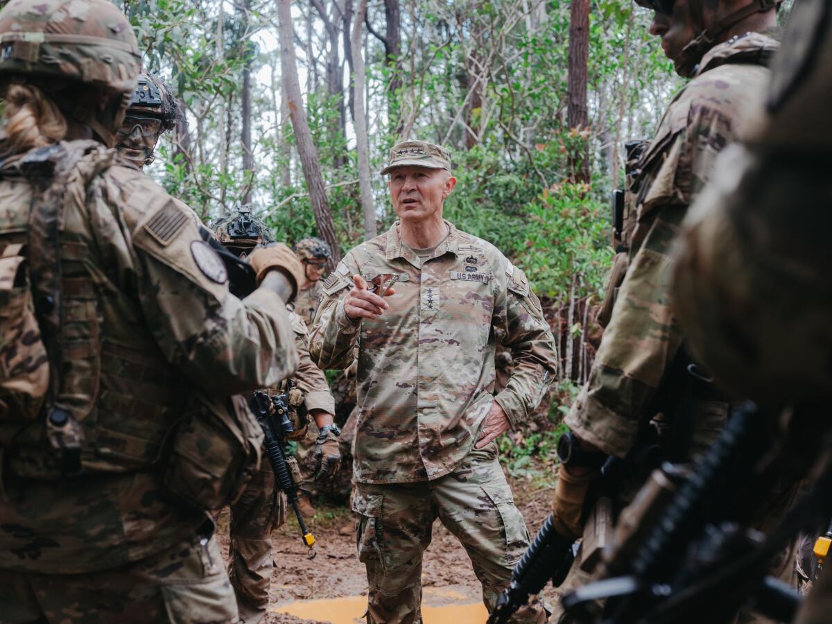 General Randy George, US Army chief of staff, speaks with soldiers during training exercises