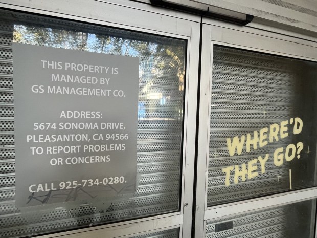 Entry area of 27 South First St., a commercial building in downtown San Jose, seen on April 2, 2026. Contact information for a property management firm and a metal barrier inside the door are visible.(George Avalos/Bay Area News Group)