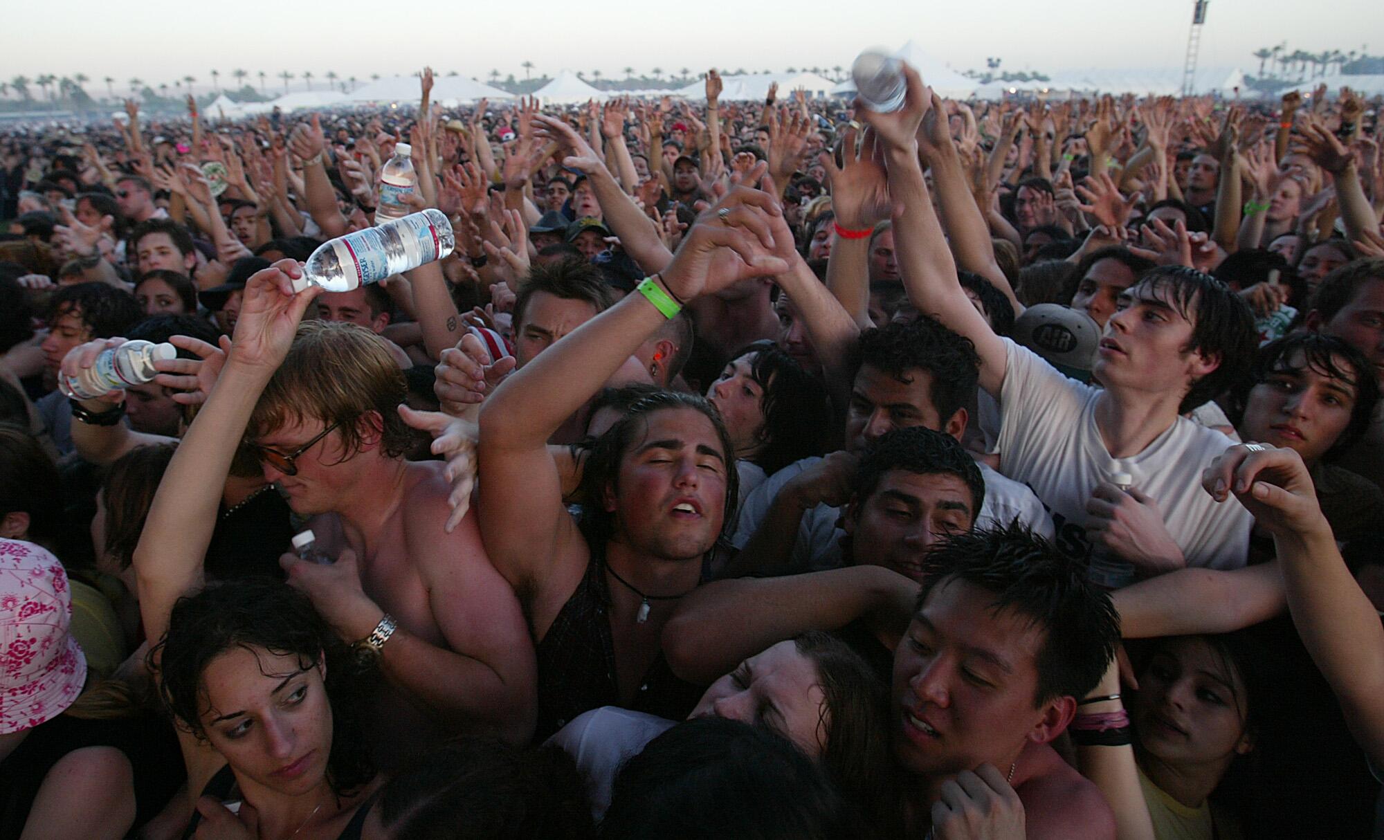 Thousands of sweaty fans at a concert
