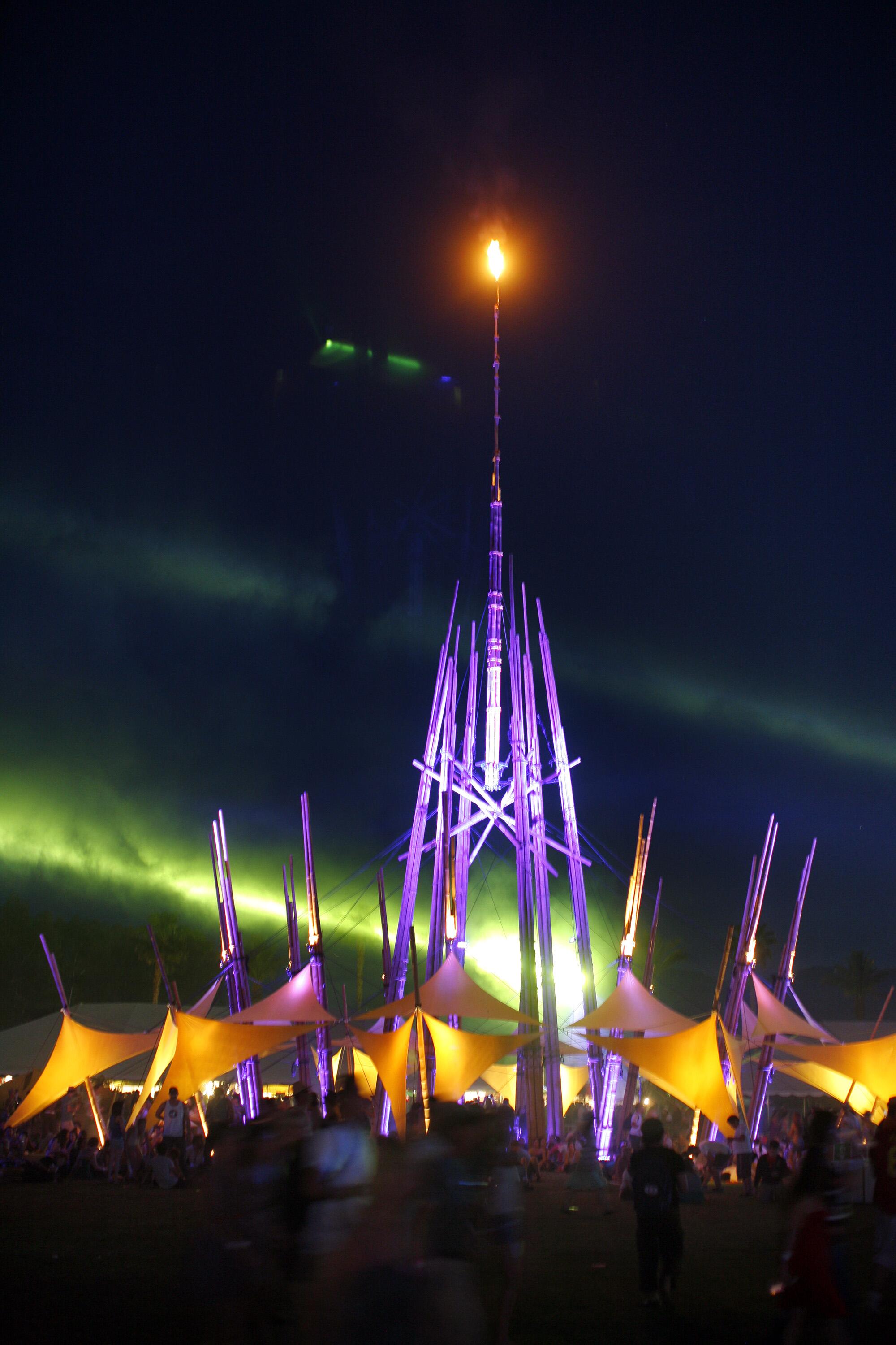 a large bamboo tower lit up at night