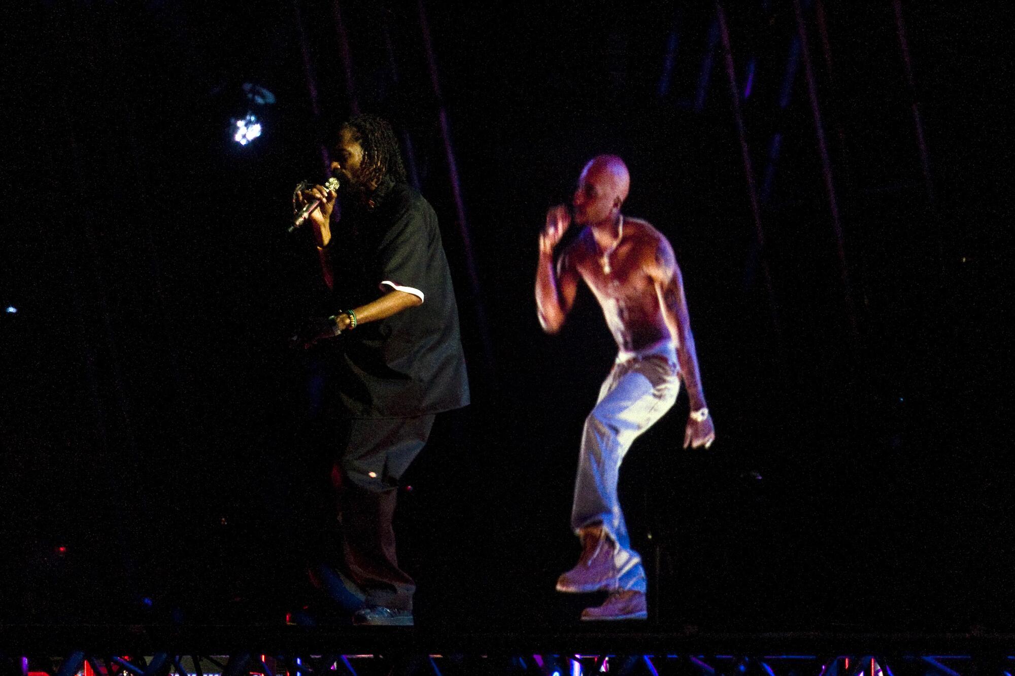 Snoop Dogg and a hologram of 2pac 