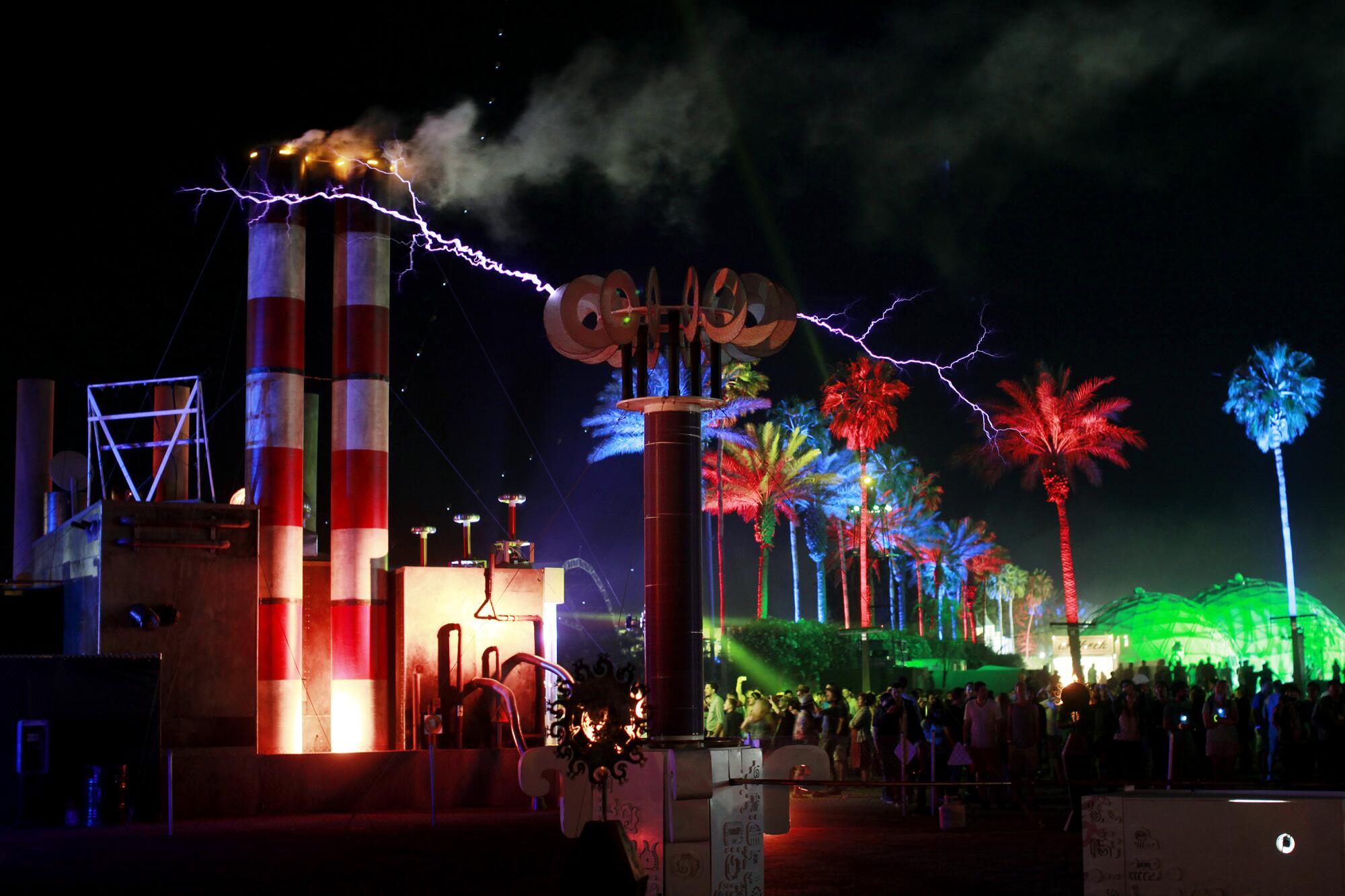  Twin Tesla Coils, go off with colorful palm trees in the background