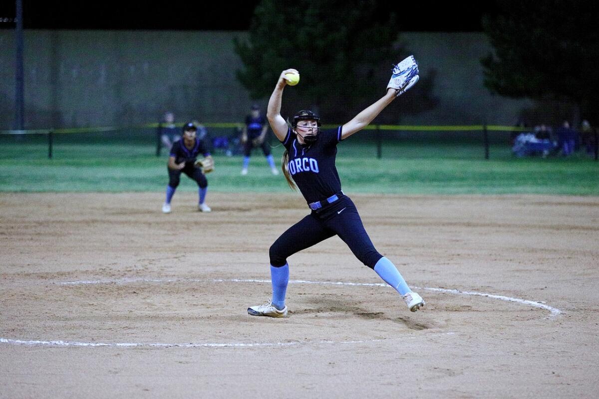 Norco pitcher Coral Williams strides forward as she windmills a pitch.