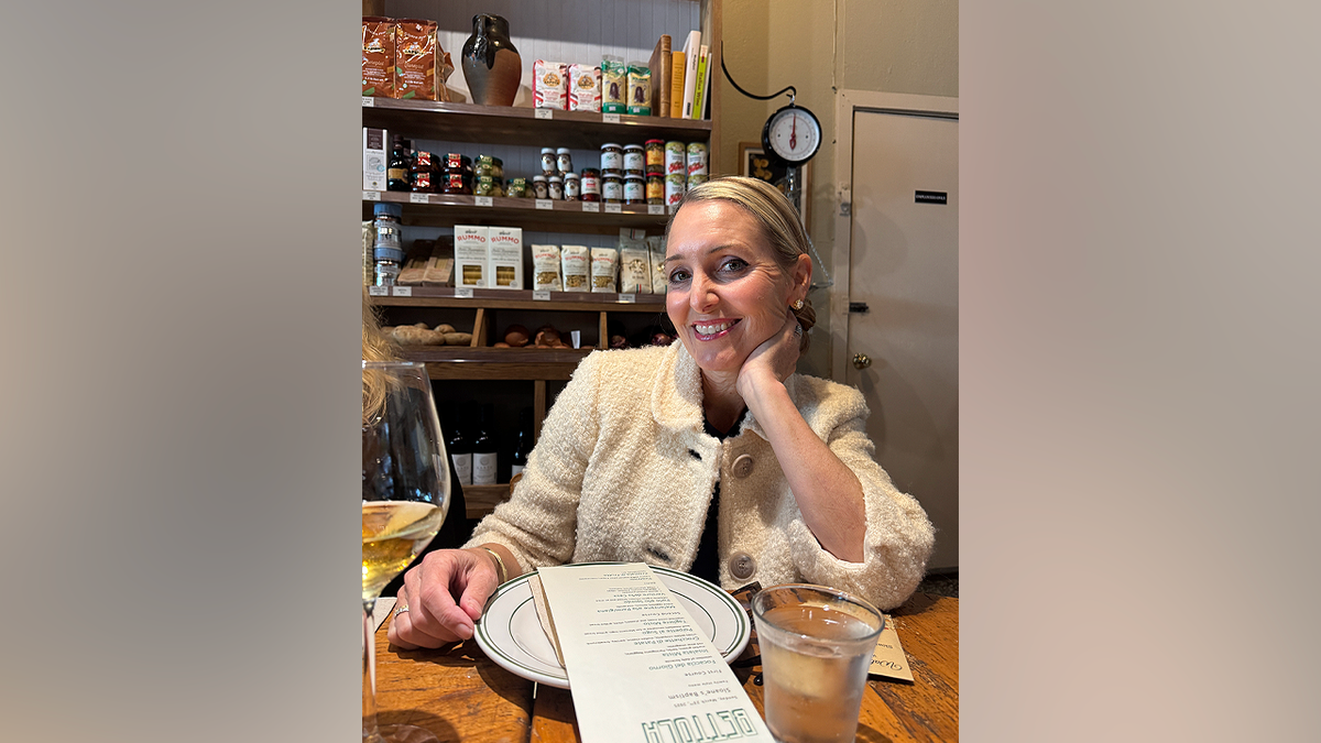 Amy Hillyard seated at a restaurant table.